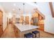 Island kitchen featuring wood cabinets, stainless appliances, and a marble countertop at 297 Robertson Ln, Breckenridge, CO 80424