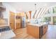 Open kitchen featuring wood cabinets, stainless appliances and an island with marble countertop at 297 Robertson Ln, Breckenridge, CO 80424