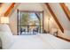 Bedroom featuring an open balcony, offering scenic mountain views and a relaxing ambiance at 297 Robertson Ln, Breckenridge, CO 80424