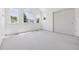 Bright bedroom with vaulted ceiling, multiple windows, white carpet and closet with sliding doors at 6393 S Jamaica Ct, Englewood, CO 80111
