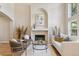 Inviting living room featuring a cozy fireplace, comfortable seating, and stylish decor creating a warm and inviting atmosphere at 6393 S Jamaica Ct, Englewood, CO 80111