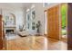 Spacious living room with high ceilings, fireplace, and large windows offering abundant natural light and a cozy ambiance at 6393 S Jamaica Ct, Englewood, CO 80111