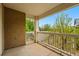 Outdoor balcony space with white railings providing open views of the surrounding trees at 8200 E 8Th Ave # 5-204, Denver, CO 80230