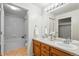 Well-lit bathroom with double sinks and shower-tub combination at 8200 E 8Th Ave # 5-204, Denver, CO 80230