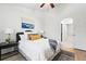 Comfortable bedroom featuring a queen-sized bed, stylish bedding, and an ensuite bathroom for added convenience at 8200 E 8Th Ave # 5-204, Denver, CO 80230