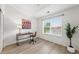Bright office space with large window, desk, and chair, perfect for a productive and comfortable work environment at 8200 E 8Th Ave # 5-204, Denver, CO 80230