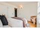 Comfortable bedroom with white walls, hardwood floors, and ample closet space at 2301 E Fremont Ave # W03, Centennial, CO 80122