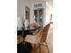 Stylish dining area featuring a dark table, woven chairs, and elegant decor at 2301 E Fremont Ave # W03, Centennial, CO 80122