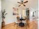 Cozy dining room features hardwood floors, a modern ceiling fan, and stylish furnishings at 2301 E Fremont Ave # W03, Centennial, CO 80122