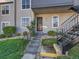 Exterior view of the front entrance with stone steps, iron railings and a secure door at 2301 E Fremont Ave # W03, Centennial, CO 80122