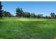 Expansive view of the lush green golf course under a clear blue sky at 2301 E Fremont Ave # W03, Centennial, CO 80122