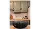Bright kitchen with painted cabinets, butcher block counters, and decorative elements on display at 2301 E Fremont Ave # W03, Centennial, CO 80122