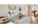 Inviting living room featuring neutral decor, comfortable seating, and an open layout at 2301 E Fremont Ave # W03, Centennial, CO 80122