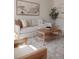 Stylish living room with comfortable seating, neutral tones, and a chic coffee table decor at 2301 E Fremont Ave # W03, Centennial, CO 80122