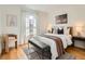 Bright main bedroom with natural light, neutral decor, and a comfortable seating area at 2301 E Fremont Ave # W03, Centennial, CO 80122
