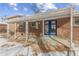 Covered patio with brick exterior and access to backyard at 12352 E 30Th Ave, Aurora, CO 80011