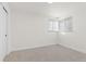 Well-lit bedroom with neutral walls and carpet flooring at 12352 E 30Th Ave, Aurora, CO 80011