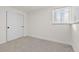 Spacious bedroom with neutral walls, carpet flooring, and sliding closet doors at 12352 E 30Th Ave, Aurora, CO 80011