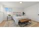 Bright bedroom with a comfortable bed and neutral color palette at 12352 E 30Th Ave, Aurora, CO 80011