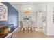 Elegant dining room with glass table and modern chairs at 12352 E 30Th Ave, Aurora, CO 80011