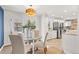 Bright dining area with a view to the kitchen at 12352 E 30Th Ave, Aurora, CO 80011