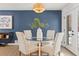 Modern dining room with glass table and four chairs at 12352 E 30Th Ave, Aurora, CO 80011