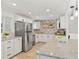 Modern kitchen with white cabinets and granite countertops at 12352 E 30Th Ave, Aurora, CO 80011