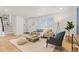 Bright living room featuring hardwood floors and comfy seating at 12352 E 30Th Ave, Aurora, CO 80011