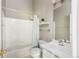 Clean and bright bathroom with tile flooring, a bathtub with shower, and a white vanity sink at 3098 W 107Th Pl # C, Westminster, CO 80031