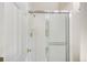 Bathroom shower with white subway tile, chrome fixtures, and glass sliding doors at 3098 W 107Th Pl # C, Westminster, CO 80031