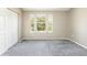 Bright bedroom featuring a window with natural light, neutral walls, and a closet for convenient storage at 3098 W 107Th Pl # C, Westminster, CO 80031