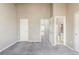 Bright bedroom with vaulted ceiling, plush carpeting, and access to an ensuite bathroom and walk-in closet at 3098 W 107Th Pl # C, Westminster, CO 80031