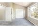 Bedroom with vaulted ceiling, plush carpeting, and access to an ensuite bathroom and closet at 3098 W 107Th Pl # C, Westminster, CO 80031