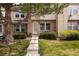 Charming brick townhouse featuring a cozy front porch and well-maintained landscaping at 3098 W 107Th Pl # C, Westminster, CO 80031