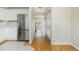 Hallway featuring hardwood floors connecting the kitchen to the living spaces at 3098 W 107Th Pl # C, Westminster, CO 80031