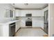 Well-lit kitchen featuring white cabinets, stainless steel appliances, and tile floors at 3098 W 107Th Pl # C, Westminster, CO 80031