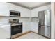 Bright kitchen showcases stainless steel appliances, white cabinets, and modern finishes at 3098 W 107Th Pl # C, Westminster, CO 80031