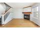 Bright living room boasts hardwood floors, a decorative fireplace, and staircase at 3098 W 107Th Pl # C, Westminster, CO 80031