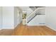 Hallway with hardwood floors leads to staircase at 3098 W 107Th Pl # C, Westminster, CO 80031