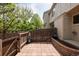 Private patio with brick pavers, wood fence, and convenient access to the building's exterior at 3098 W 107Th Pl # C, Westminster, CO 80031