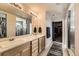 Double vanity bathroom with walk-in shower and large closet at 3438 Cade Ct, Castle Rock, CO 80104