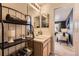 Bright bathroom with a vanity, mirror, and view into another room at 3438 Cade Ct, Castle Rock, CO 80104