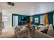 Spacious bonus room with teal walls and ample natural light at 3438 Cade Ct, Castle Rock, CO 80104