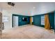 Large bonus room with teal walls, perfect for entertainment at 3438 Cade Ct, Castle Rock, CO 80104