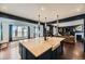 Modern kitchen island with a farmhouse sink at 3438 Cade Ct, Castle Rock, CO 80104