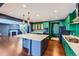 Bright kitchen with green cabinets and stainless steel appliances at 3438 Cade Ct, Castle Rock, CO 80104