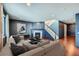 Living room with corner fireplace and hardwood floors at 3438 Cade Ct, Castle Rock, CO 80104