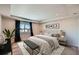 Main bedroom with mountain views, plush bed, and stylish decor at 3438 Cade Ct, Castle Rock, CO 80104