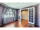 Bright home office features hardwood floors, window with blinds, and French doors at 3438 Cade Ct, Castle Rock, CO 80104