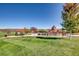 Community playground with play structures and shaded seating at 3438 Cade Ct, Castle Rock, CO 80104